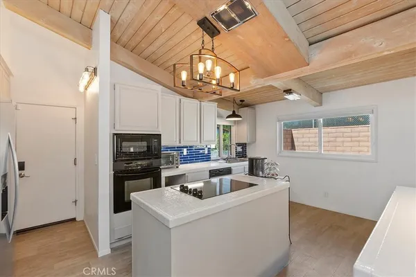 a view of kitchen and sink