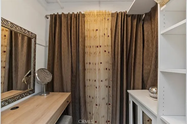 a bathroom with a sink a mirror and a shower