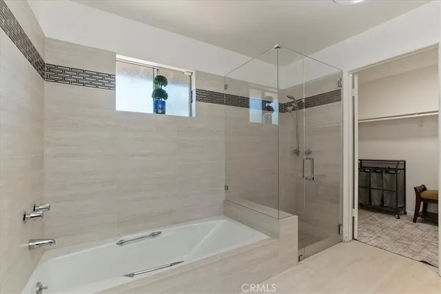 a bathroom with a shower and a tub