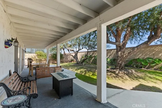 a view of a patio filled with furniture