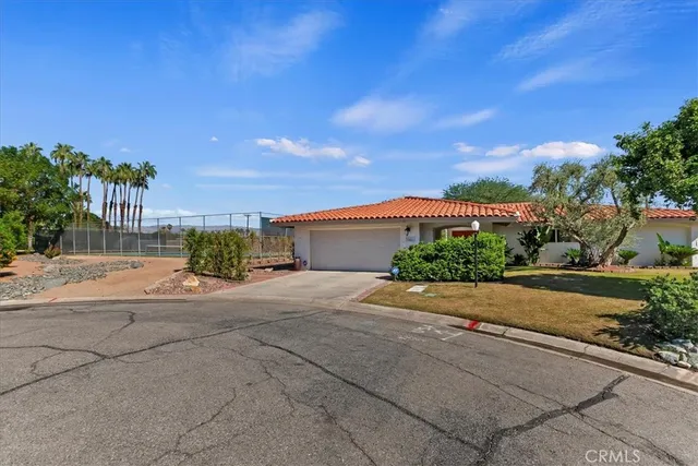 a view of a house with a street