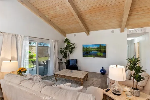 a bedroom with furniture and a potted plant