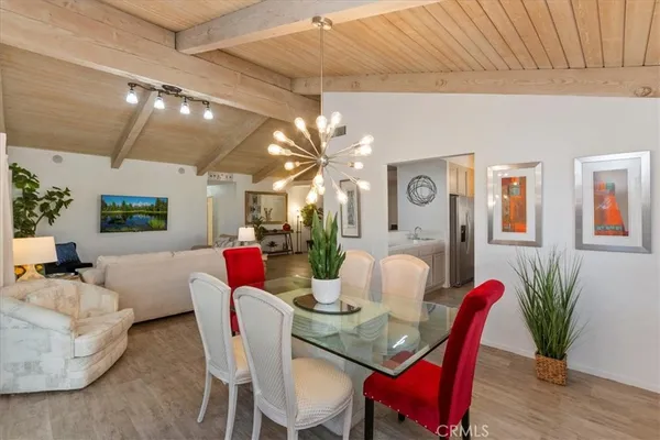 a dining room with furniture and wooden floor
