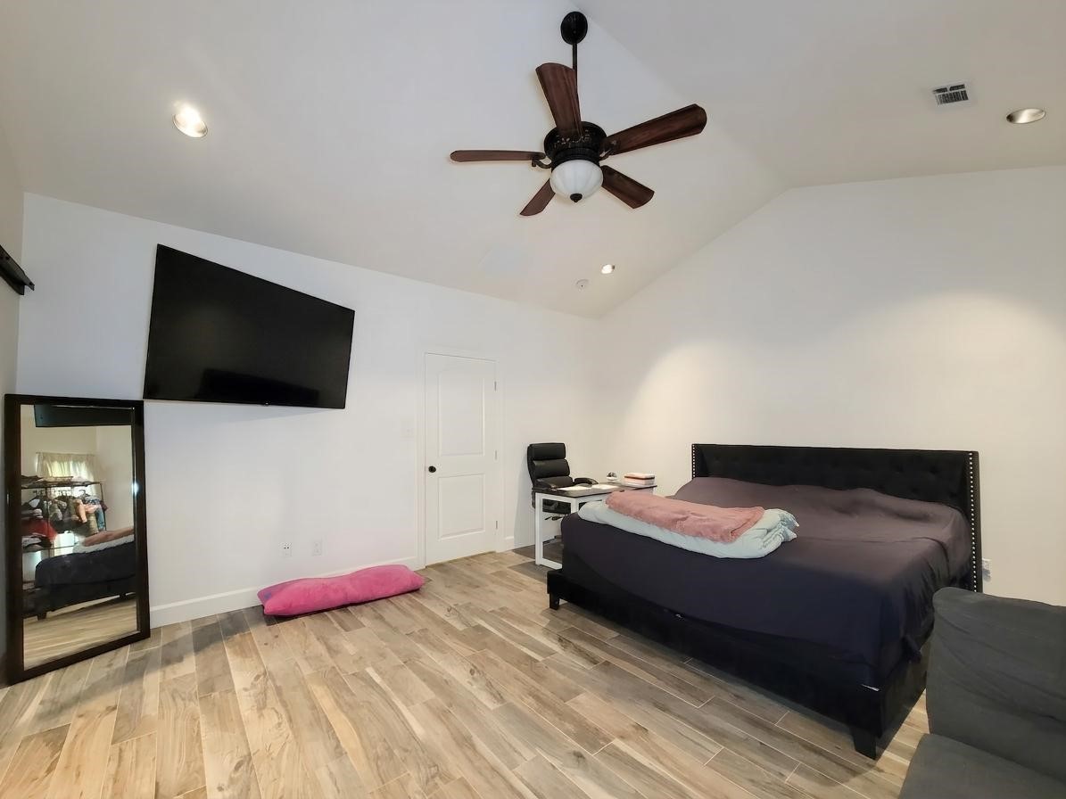 2011 Old Ox Road Spring, TX 77386 - Photo 13 of 38 a bedroom with a bed and a flat screen tv