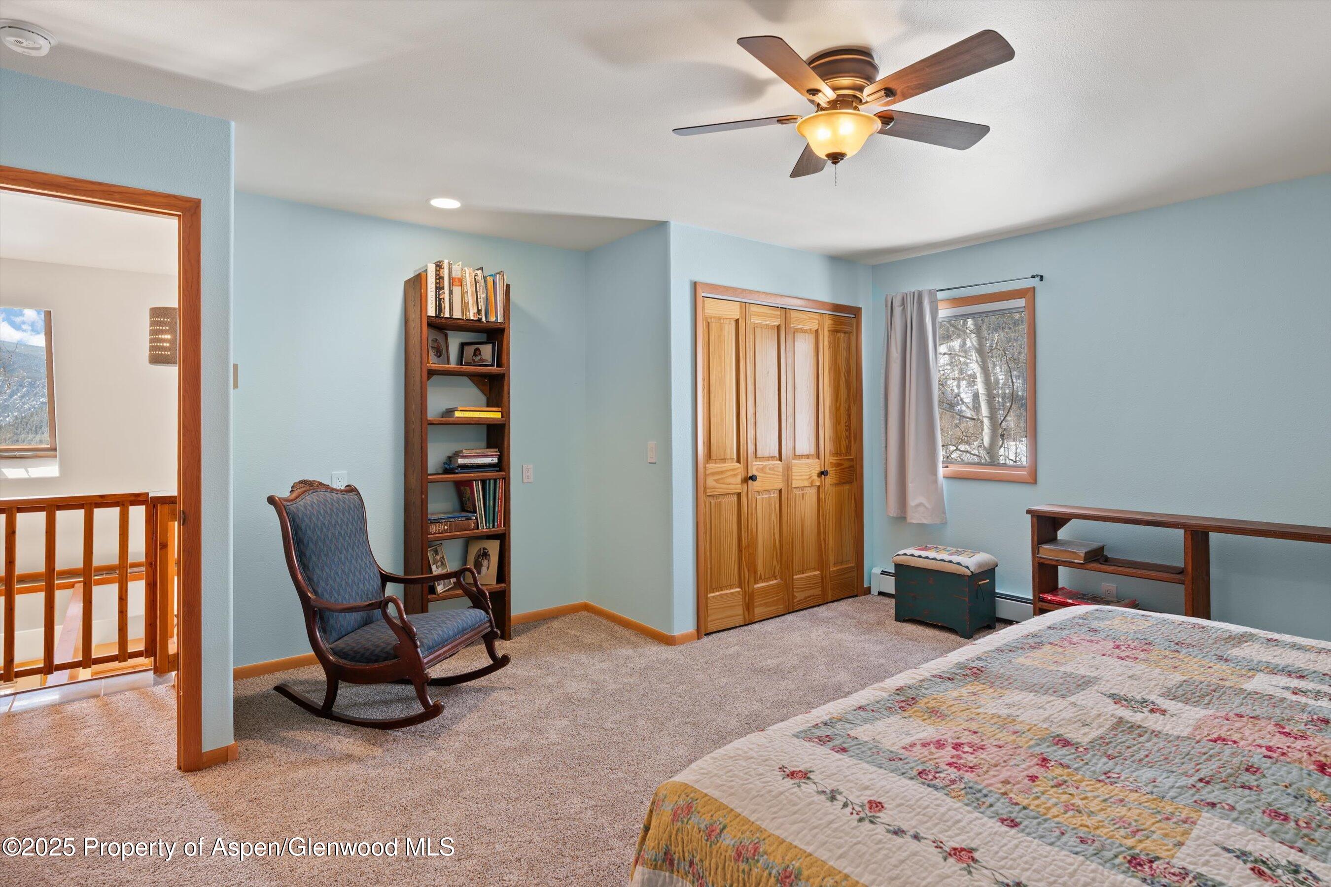 238 Hawk Lane Basalt, CO 81621 - Photo 31 of 46 a bedroom with a bed a desk and chair