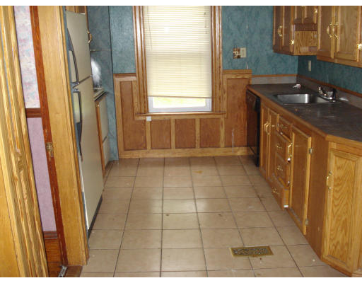 808 Elm Street Woonsocket, RI 02895 - Photo 6 of 7 a bathroom with a sink a toilet and a shower