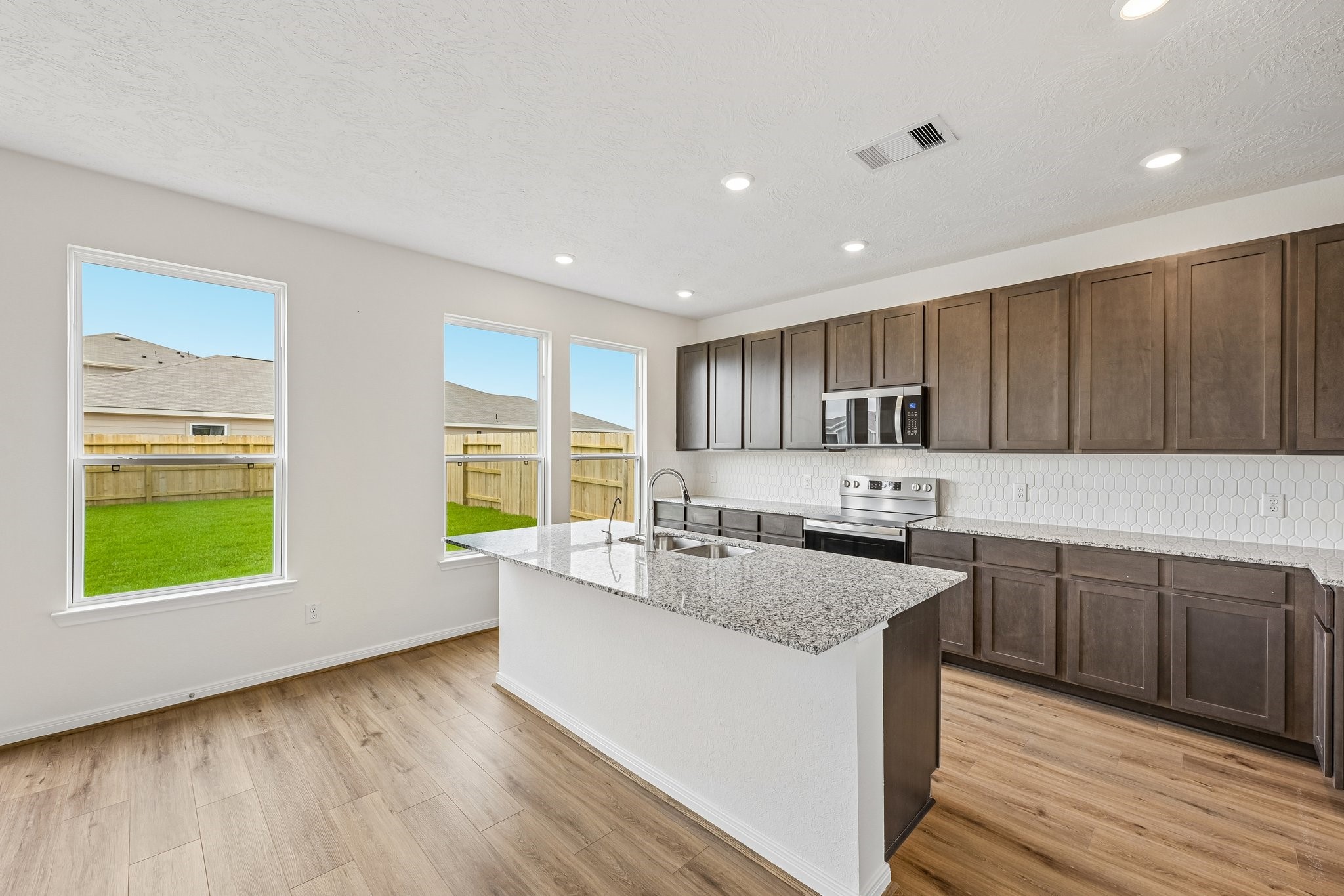 2503 Spruce Hl Road Beasley, TX 77417 - Photo 11 of 25 Convenient breakfast bar addition, perfect for casual dining and entertaining.