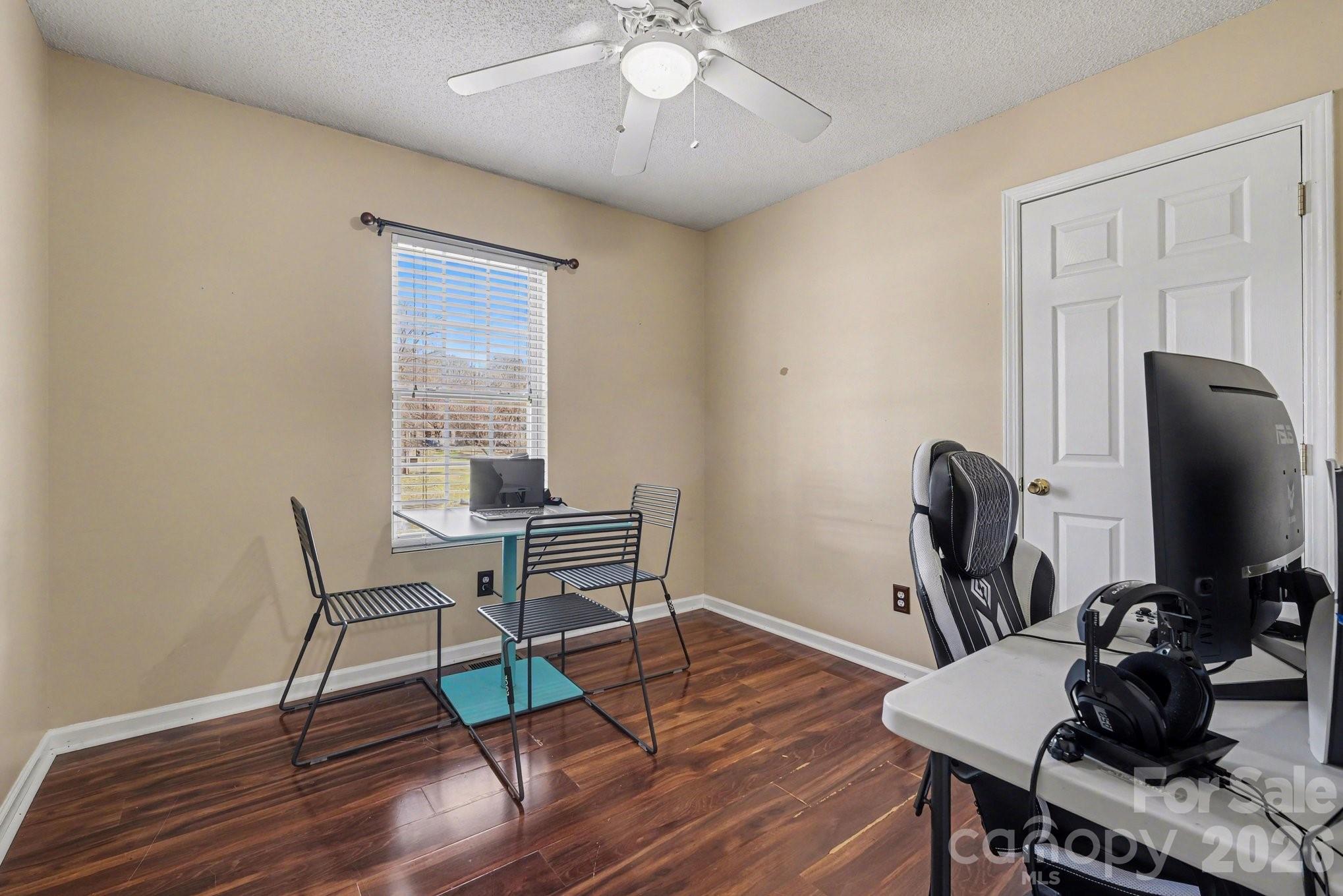 105 Chadwick Circle Dallas, NC 28034 - Photo 17 of 23 a living room with furniture and a wooden floor