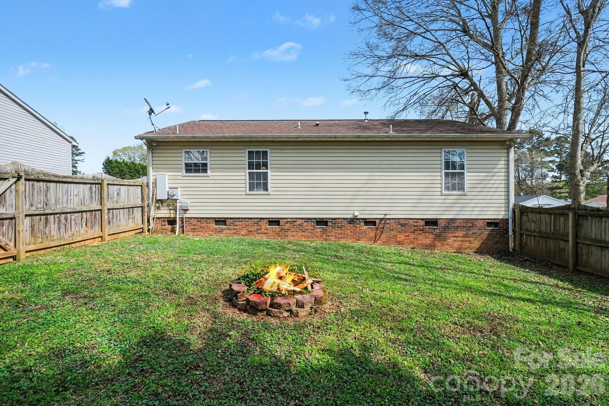 105 Chadwick Circle Dallas, NC 28034 - Photo 21 of 23 a front view of a house with a yard and garage