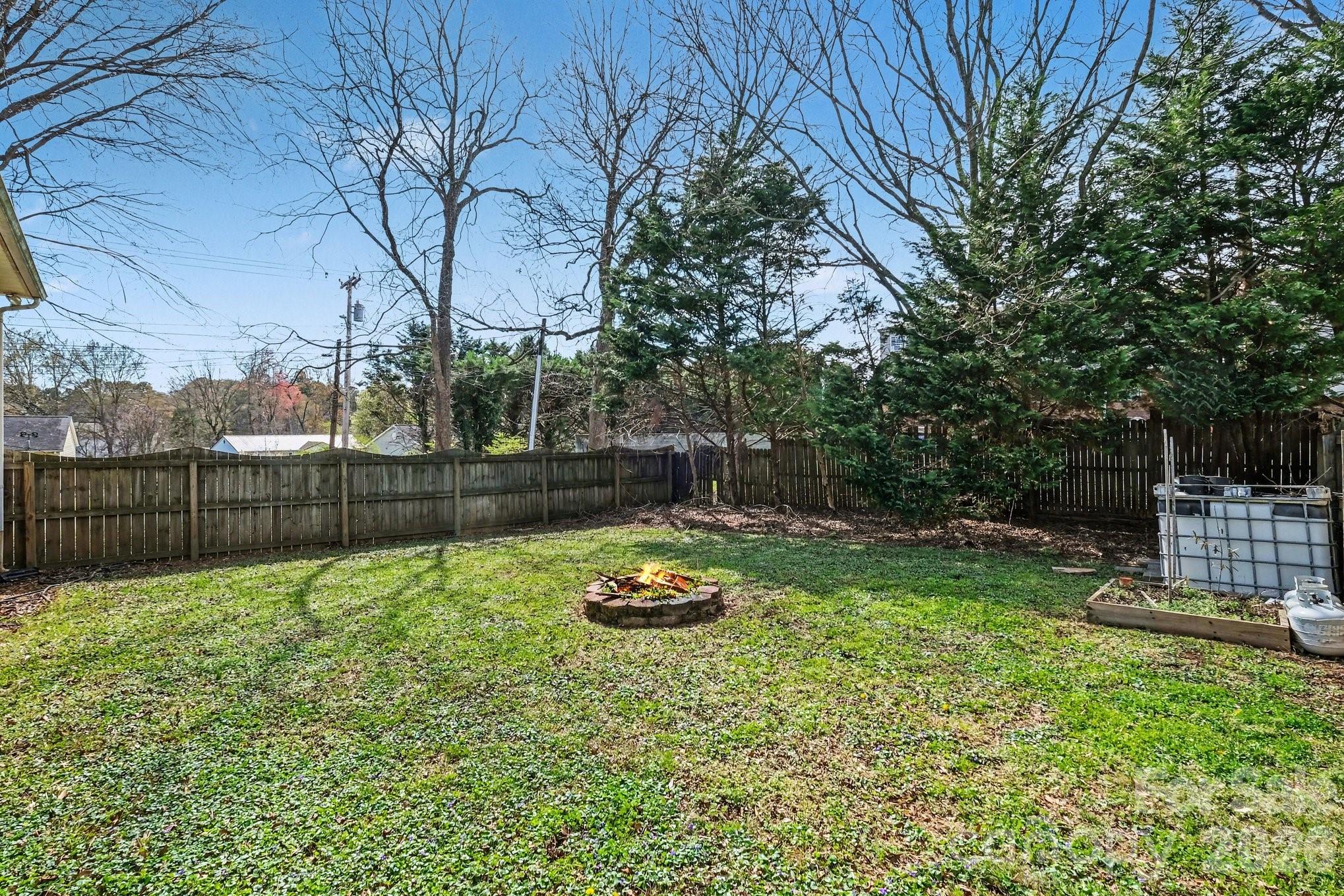 105 Chadwick Circle Dallas, NC 28034 - Photo 23 of 23 a backyard of a house with lots of green space