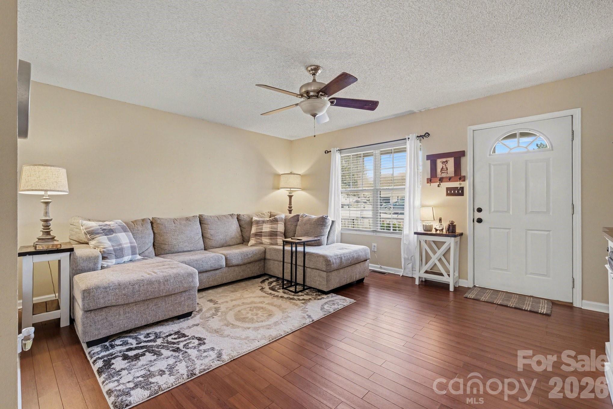 105 Chadwick Circle Dallas, NC 28034 - Photo 5 of 23 a living room with furniture and a wooden floor