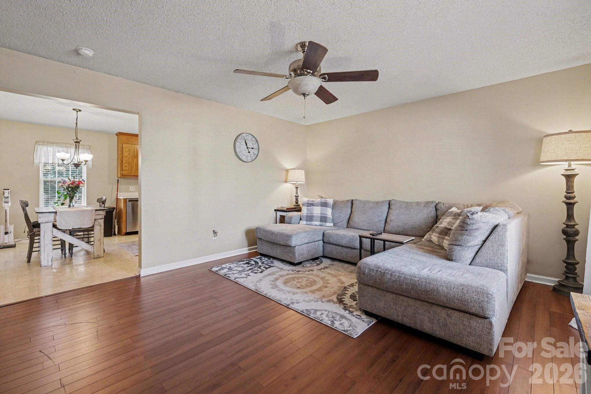 105 Chadwick Circle Dallas, NC 28034 - Photo 7 of 23 a living room with furniture and a wooden floor