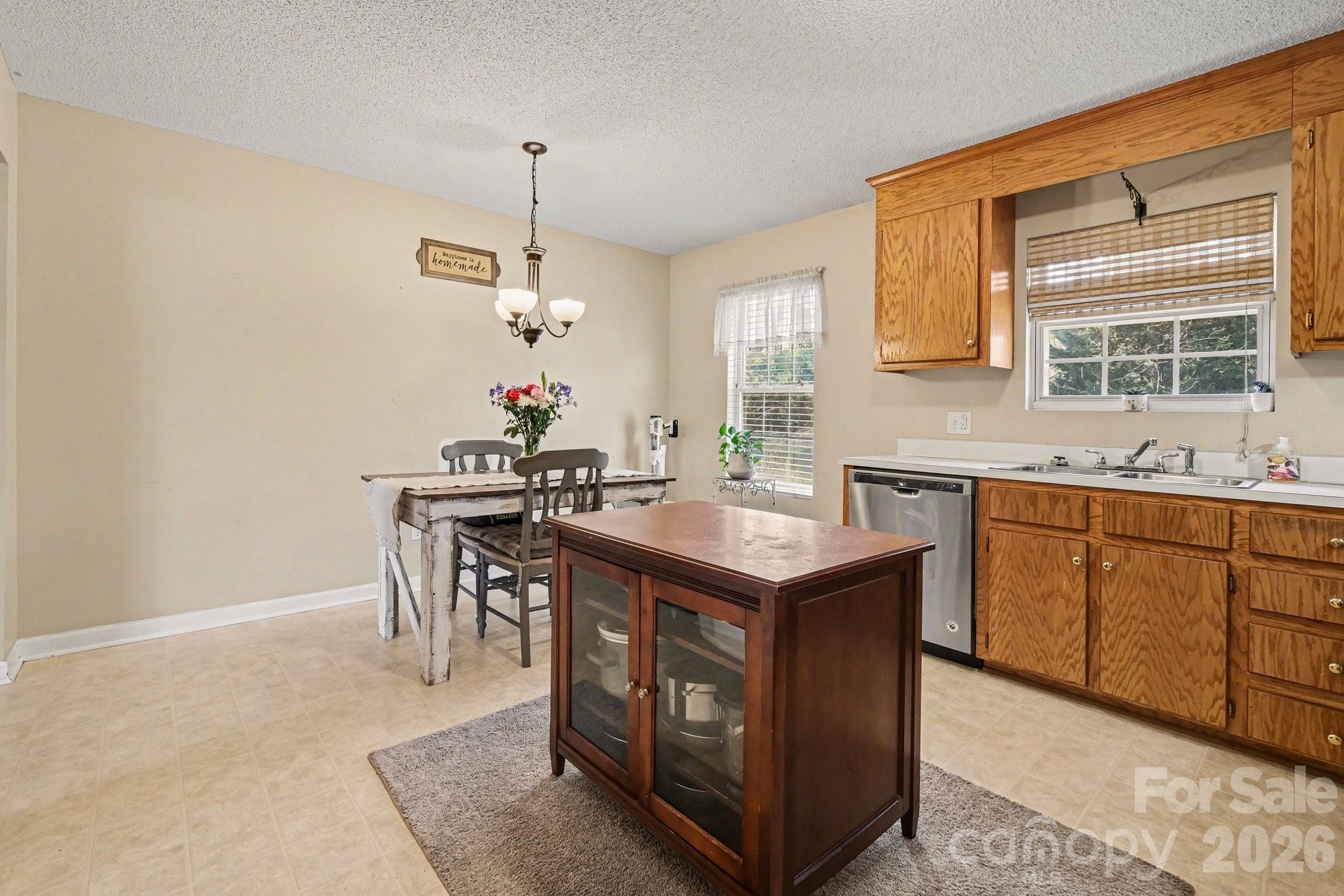 105 Chadwick Circle Dallas, NC 28034 - Photo 10 of 23 a kitchen with a sink cabinets and window