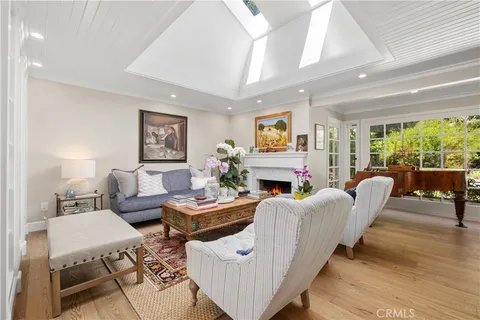 a living room with furniture a rug and a fireplace