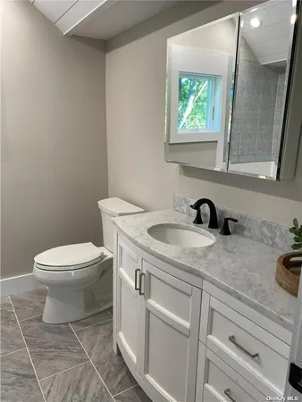 a view of a bathroom with a sink and a toilet