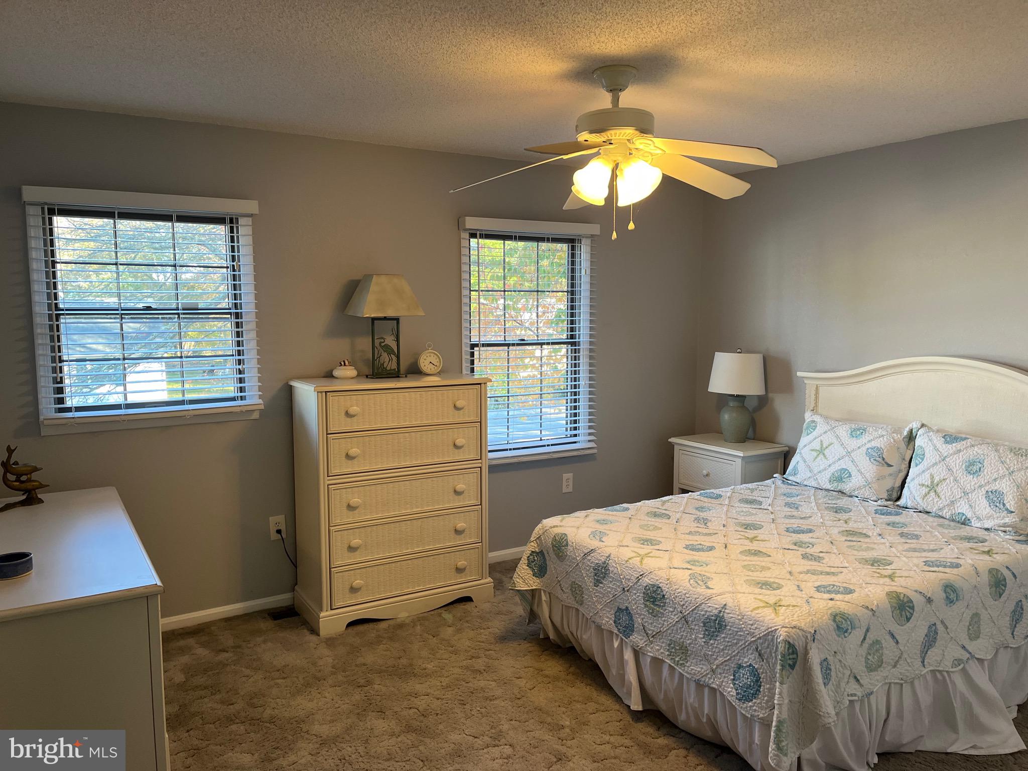14103 Derrickson Avenue Ocean City, MD 21842 - Photo 11 of 33 a bedroom with a bed and a window