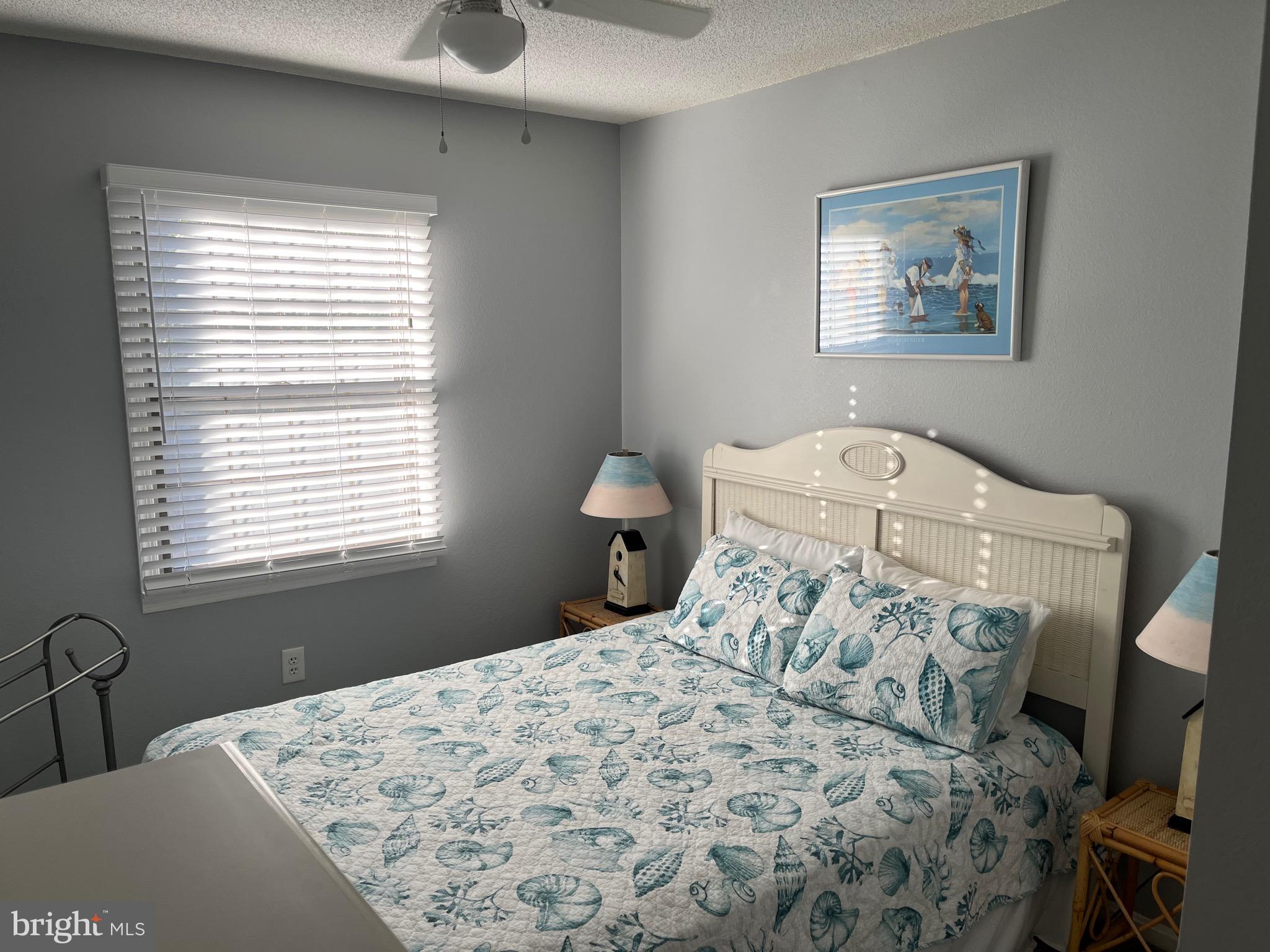 14103 Derrickson Avenue Ocean City, MD 21842 - Photo 18 of 33 a bedroom with a bed and a window