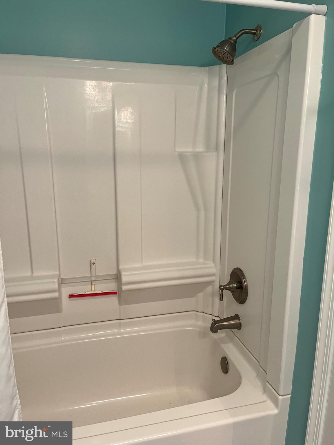 14103 Derrickson Avenue Ocean City, MD 21842 - Photo 21 of 33 a bathroom with a bathtub and a shower