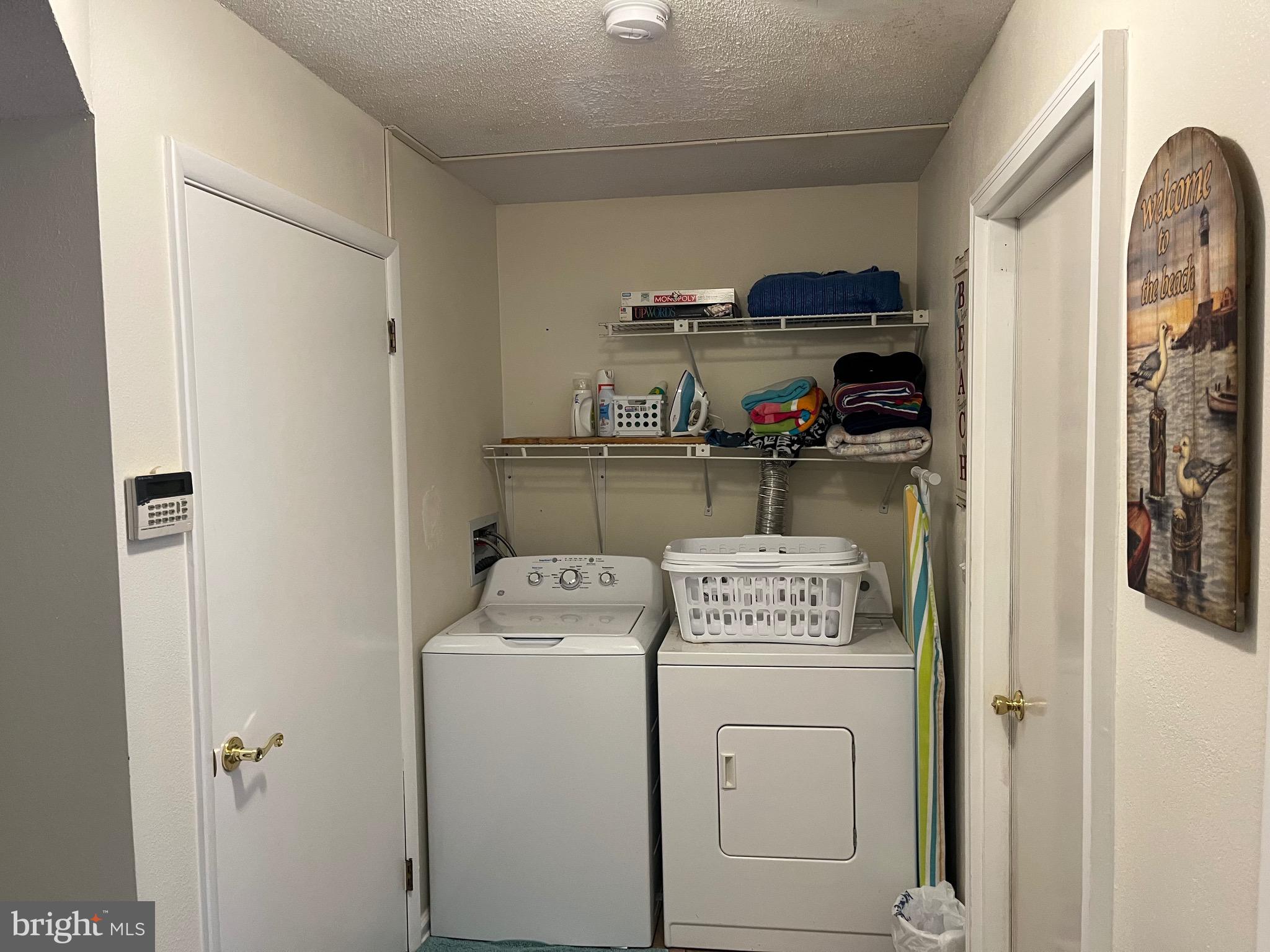 14103 Derrickson Avenue Ocean City, MD 21842 - Photo 30 of 33 a view of storage and utility room with washer and dryer