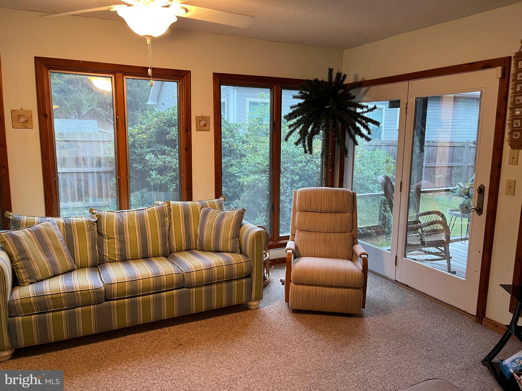 14103 Derrickson Avenue Ocean City, MD 21842 - Photo 4 of 33 a living room with furniture and a large window