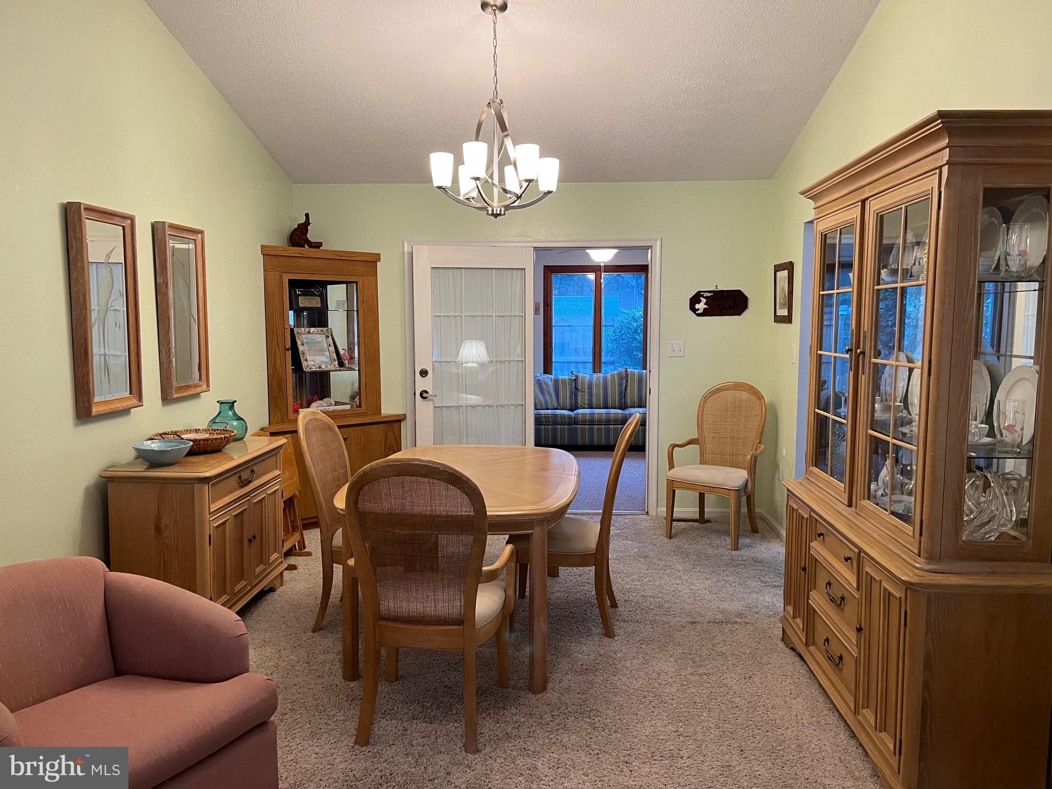 14103 Derrickson Avenue Ocean City, MD 21842 - Photo 6 of 33 a view of a livingroom with furniture and window