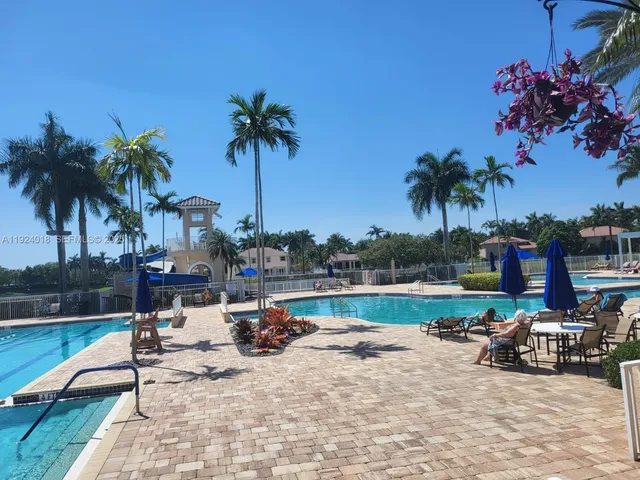 a view of a swimming pool and lounge chair