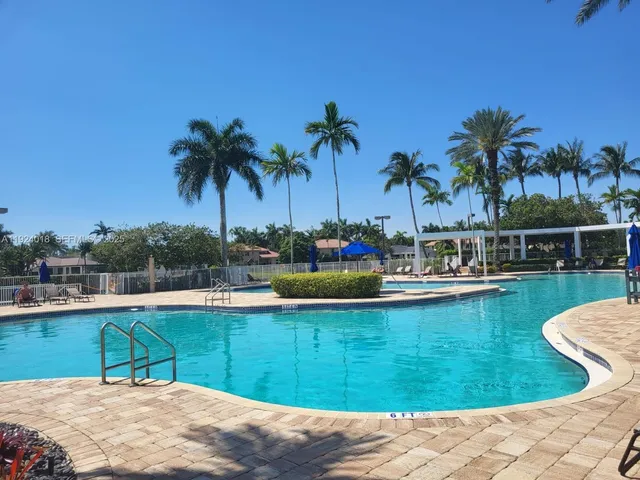 a view of a swimming pool with a lounge chairs