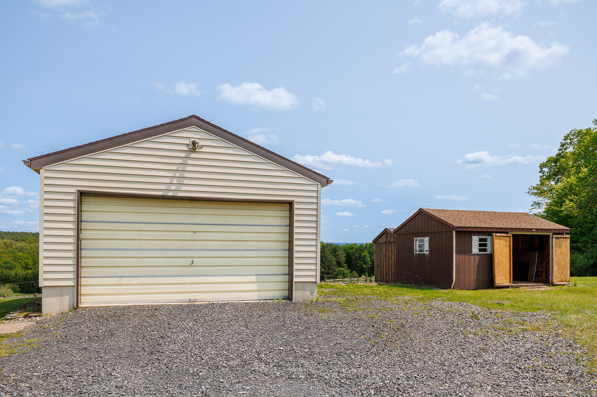 924 Hell Hollow Road Kunkletown, PA 18058 - Photo 18 of 60 a front view of a house with a yard and garage