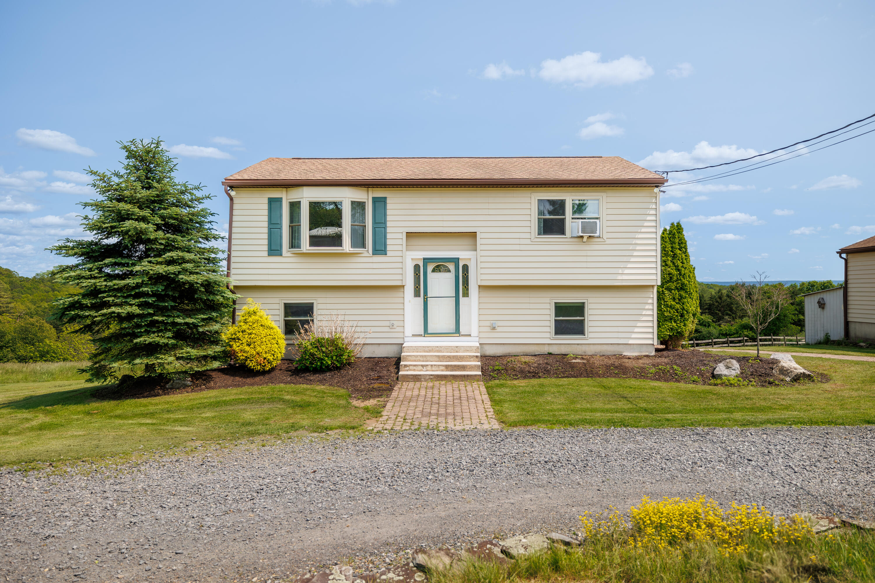 924 Hell Hollow Road Kunkletown, PA 18058 - Photo 2 of 60 a front view of a house with a yard and garage