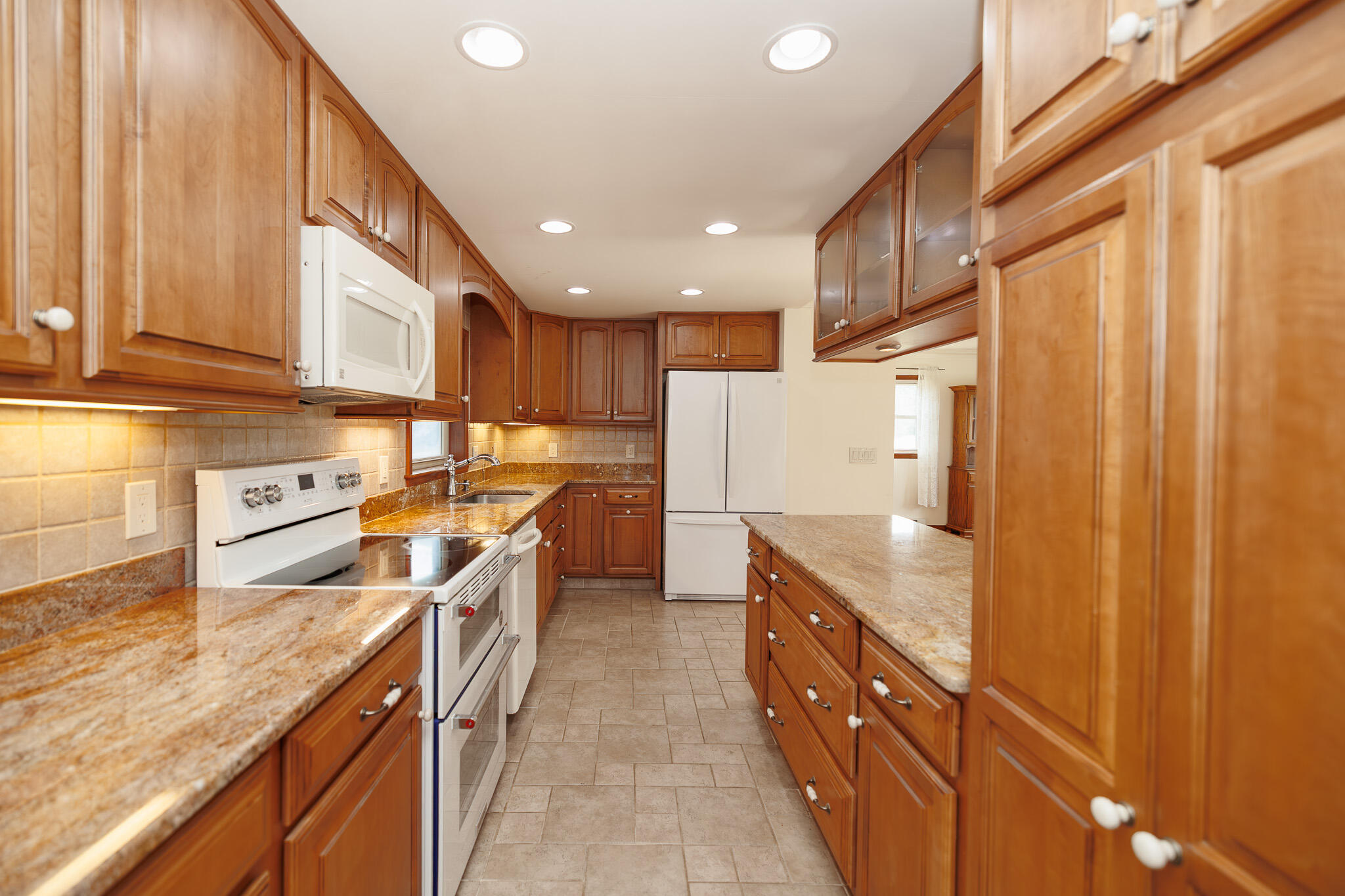 924 Hell Hollow Road Kunkletown, PA 18058 - Photo 22 of 60 a kitchen with stainless steel appliances granite countertop a sink and cabinets
