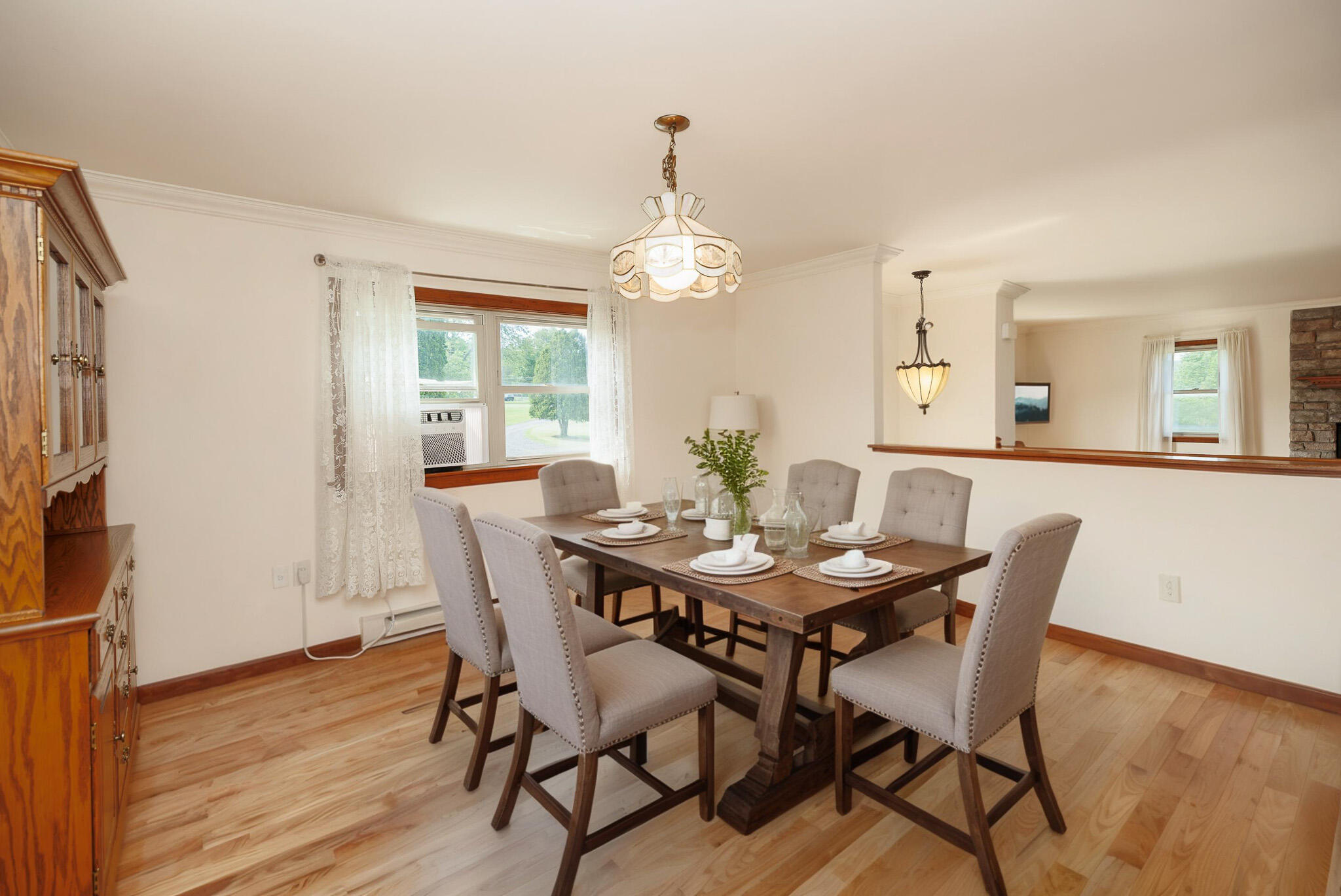 924 Hell Hollow Road Kunkletown, PA 18058 - Photo 27 of 60 a dining room with furniture a chandelier and wooden floor