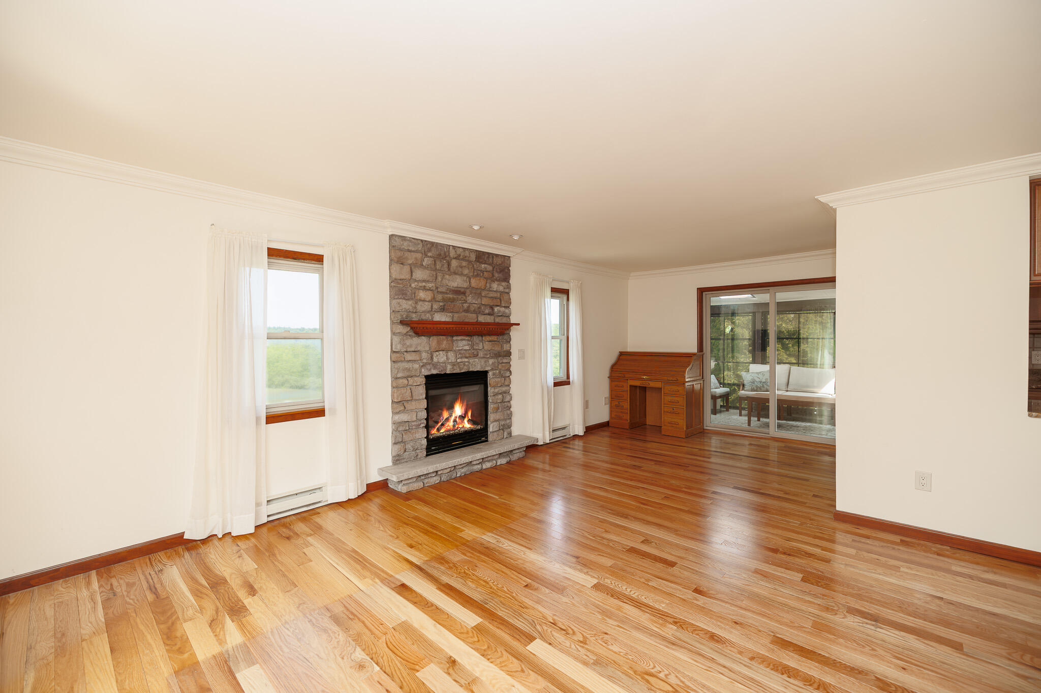 924 Hell Hollow Road Kunkletown, PA 18058 - Photo 31 of 60 a view of empty room with wooden floor and fireplace