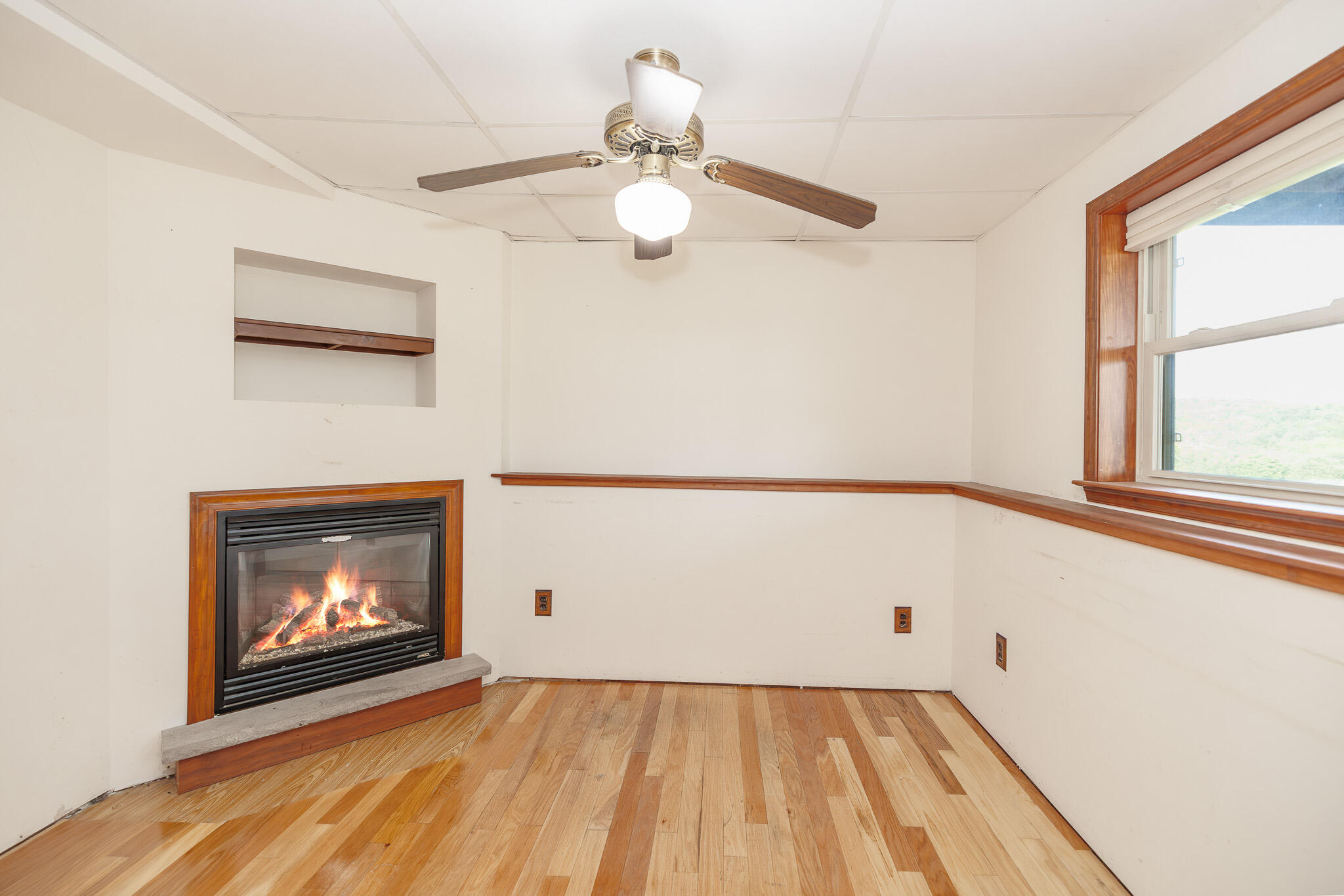 924 Hell Hollow Road Kunkletown, PA 18058 - Photo 50 of 60 a view of an empty room with wooden floor and a window