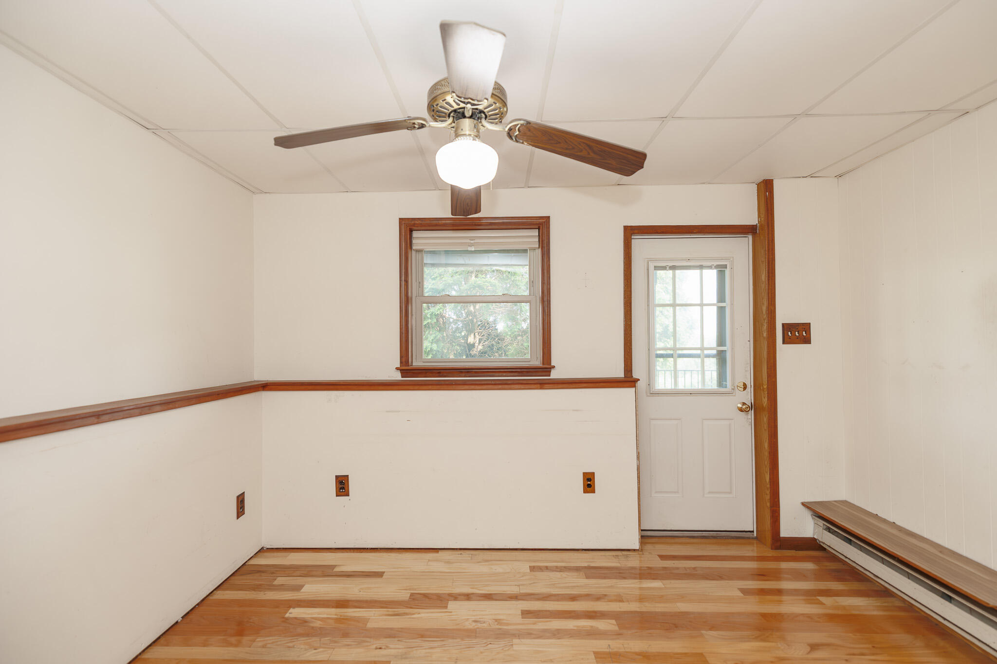 924 Hell Hollow Road Kunkletown, PA 18058 - Photo 52 of 60 a view of an empty room with wooden floor and a window