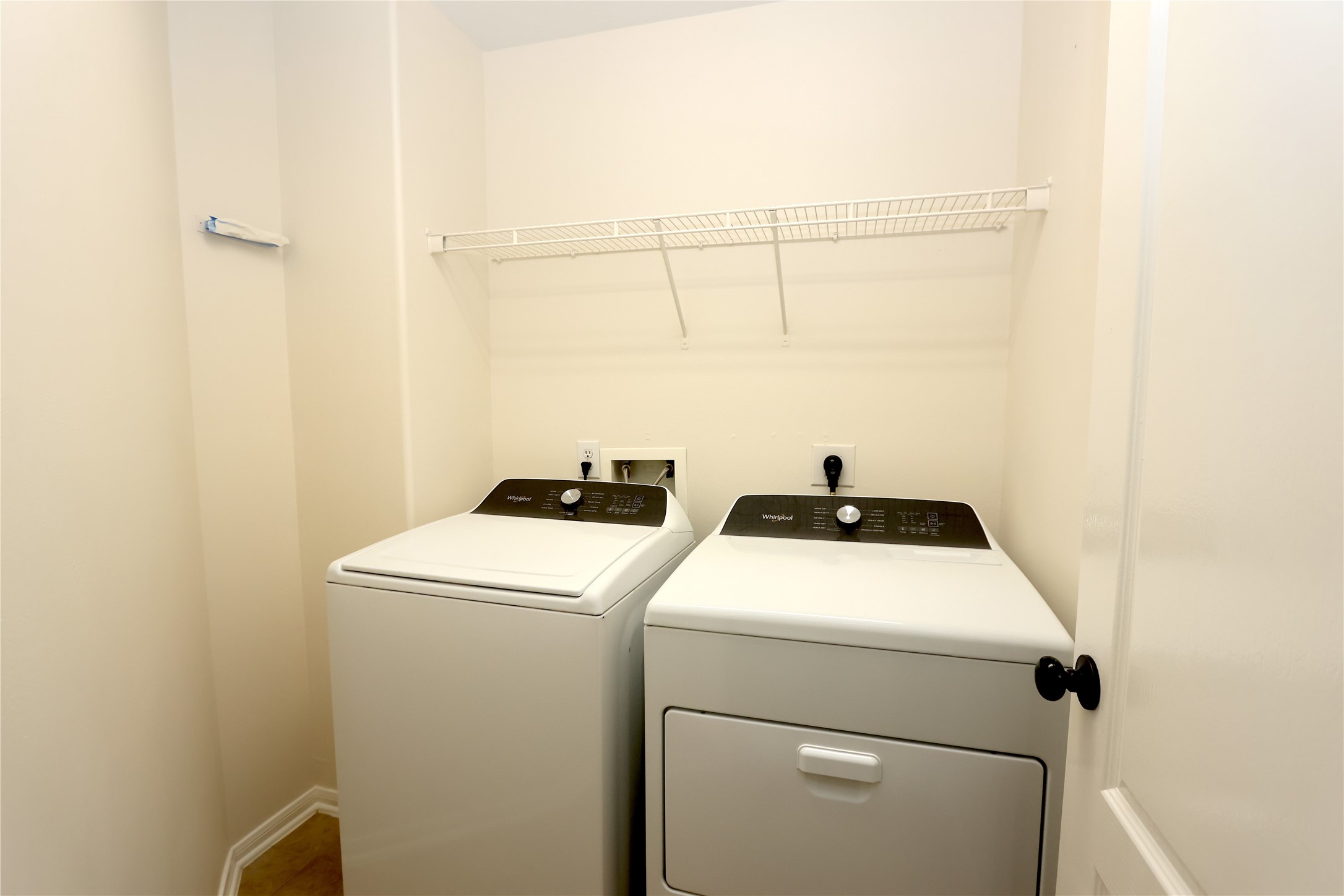 1902 Lantana Spring Lane Pearland, TX 77581 - Photo 12 of 18 a utility room with dryer and washer
