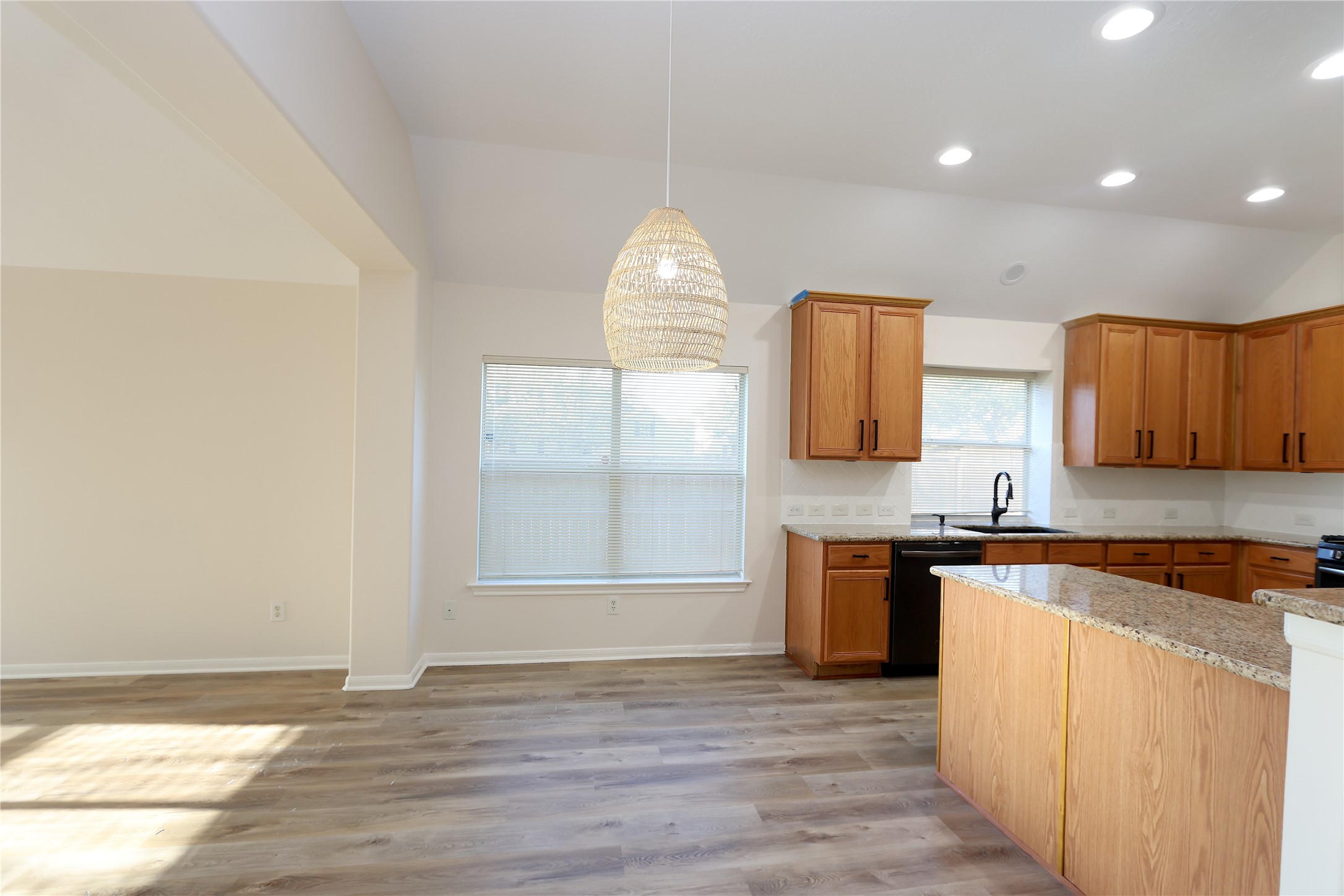 1902 Lantana Spring Lane Pearland, TX 77581 - Photo 7 of 18 an empty room with wooden floor and cabinet