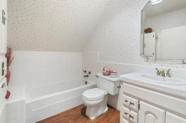 a bathroom with a sink a toilet and a bathtub