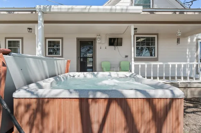 a view of kitchen with granite countertop a sink and dishwasher