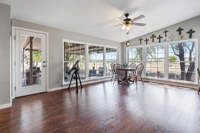 a view of a dining room with furniture window and wooden floor