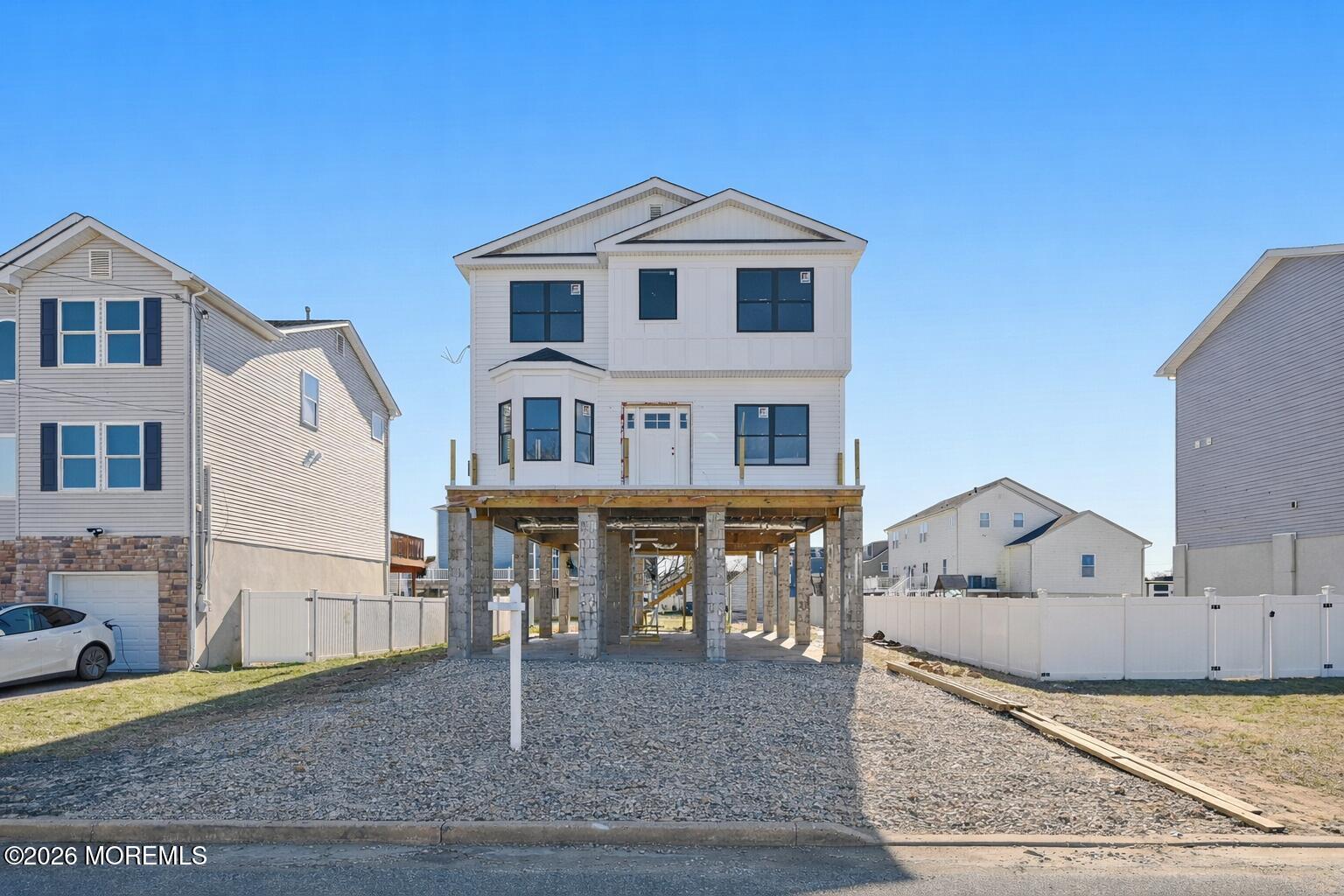 214 Raritan Street Union Beach, NJ 07735 - Photo 2 of 10 a front view of a house with garden