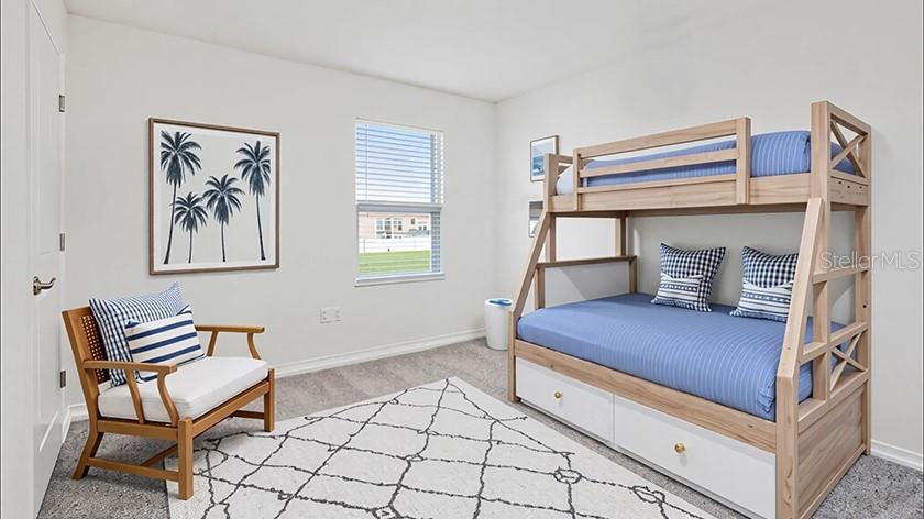 6911 Southwest 44th Circle Ocala, FL 34476 - Photo 14 of 19 a bedroom with a bunk bed and a chair