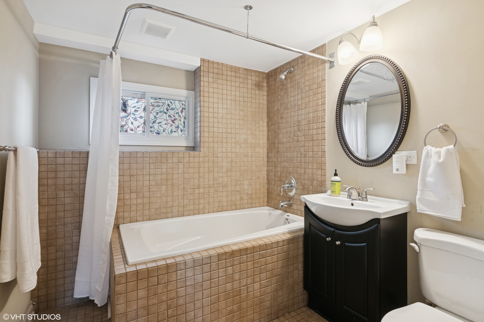 167 Glendale Street Wheeling, IL 60090 - Photo 12 of 22 a bathroom with a sink and a mirror
