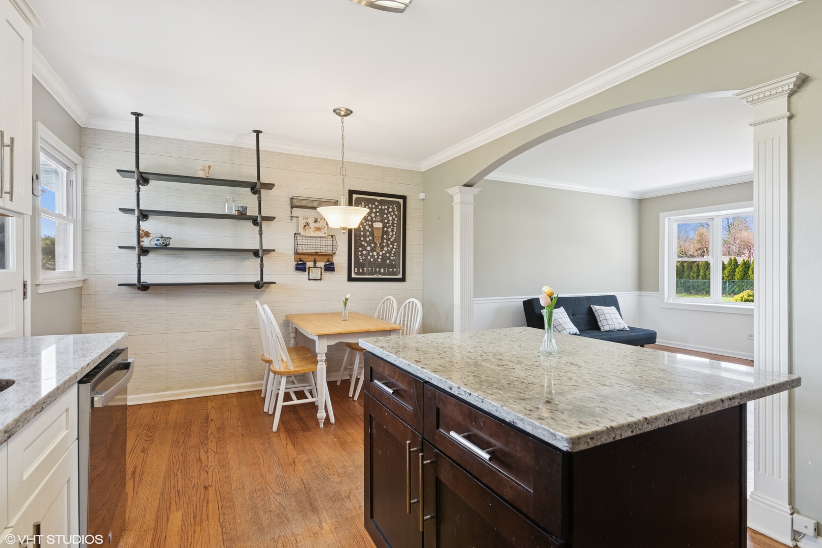 167 Glendale Street Wheeling, IL 60090 - Photo 4 of 22 a kitchen with a table chairs and wooden floor