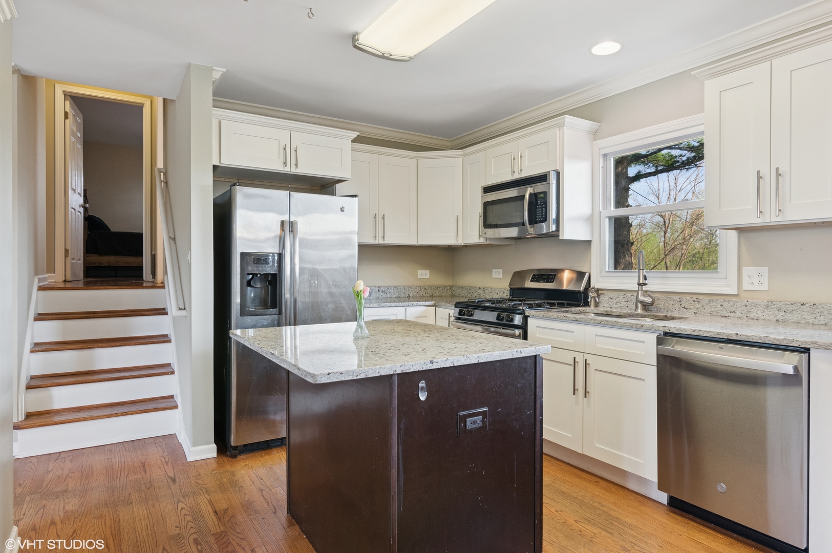 167 Glendale Street Wheeling, IL 60090 - Photo 6 of 22 a kitchen with a sink stove and refrigerator