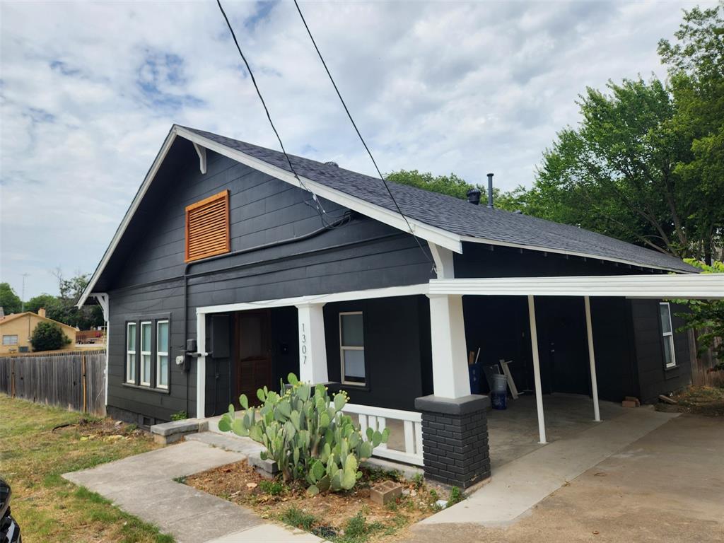 1307 South Trinity Street Decatur, TX 76234 - Photo 1 of 1 a front view of a house with garden