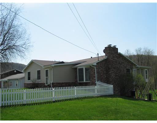 24 Barnhart Street Rural Ridge, PA 15075 - Photo 18 of 18 Exterior Front. View of front and side of the house. Gated white picket fence emcompasses the front yard. This house has a lot of charm and curb appeal.