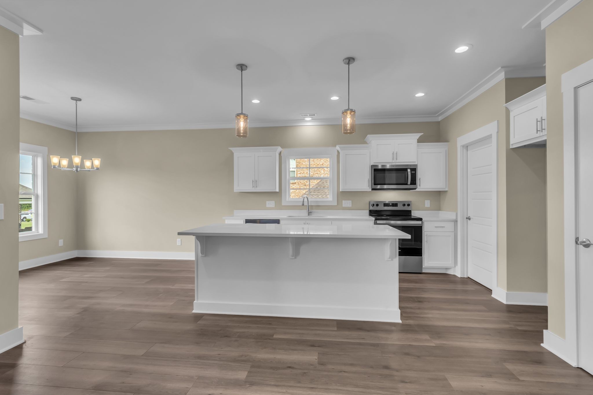 1176 Rimrock Road Smyrna, TN 37167 - Photo 13 of 40 a kitchen with kitchen island a sink cabinets and stainless steel appliances