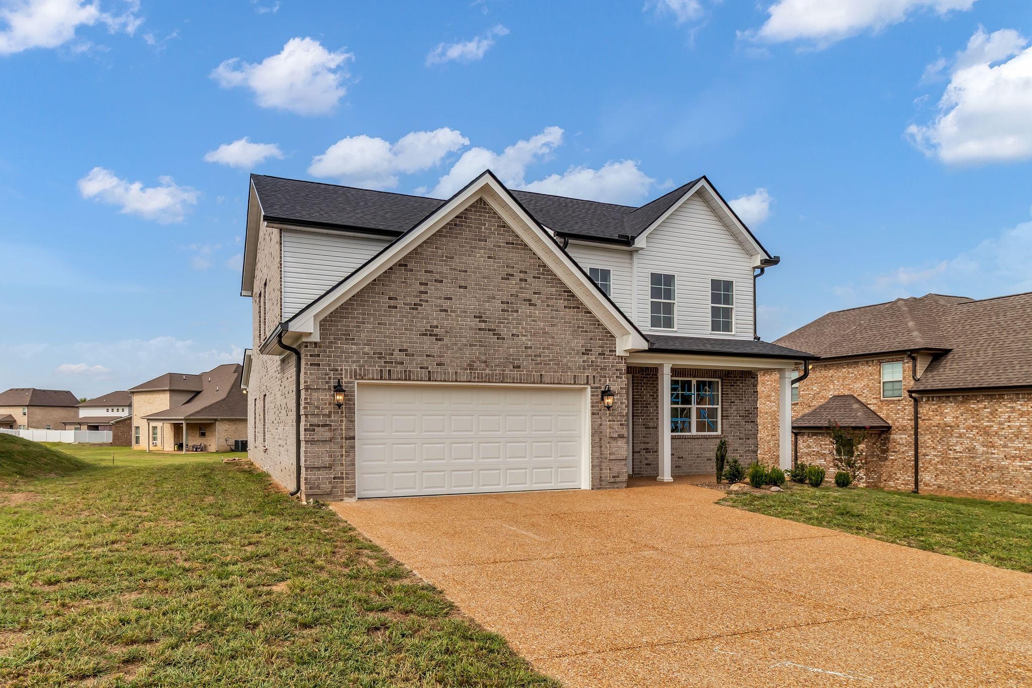 1176 Rimrock Road Smyrna, TN 37167 - Photo 3 of 40 a front view of a house with a yard
