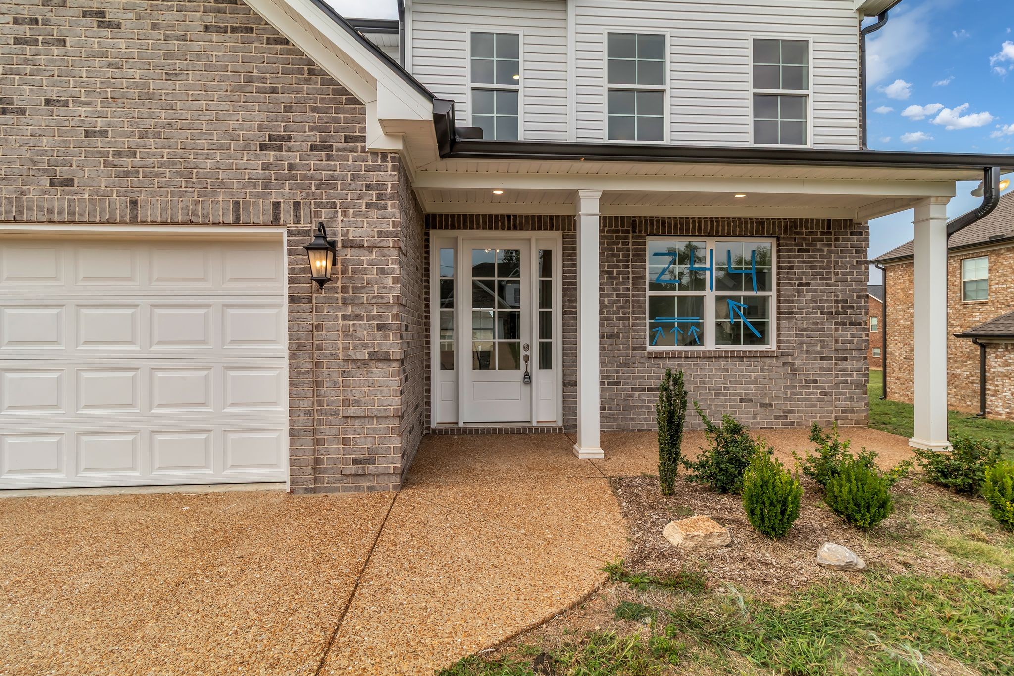 1176 Rimrock Road Smyrna, TN 37167 - Photo 4 of 40 front view of a brick house with large windows
