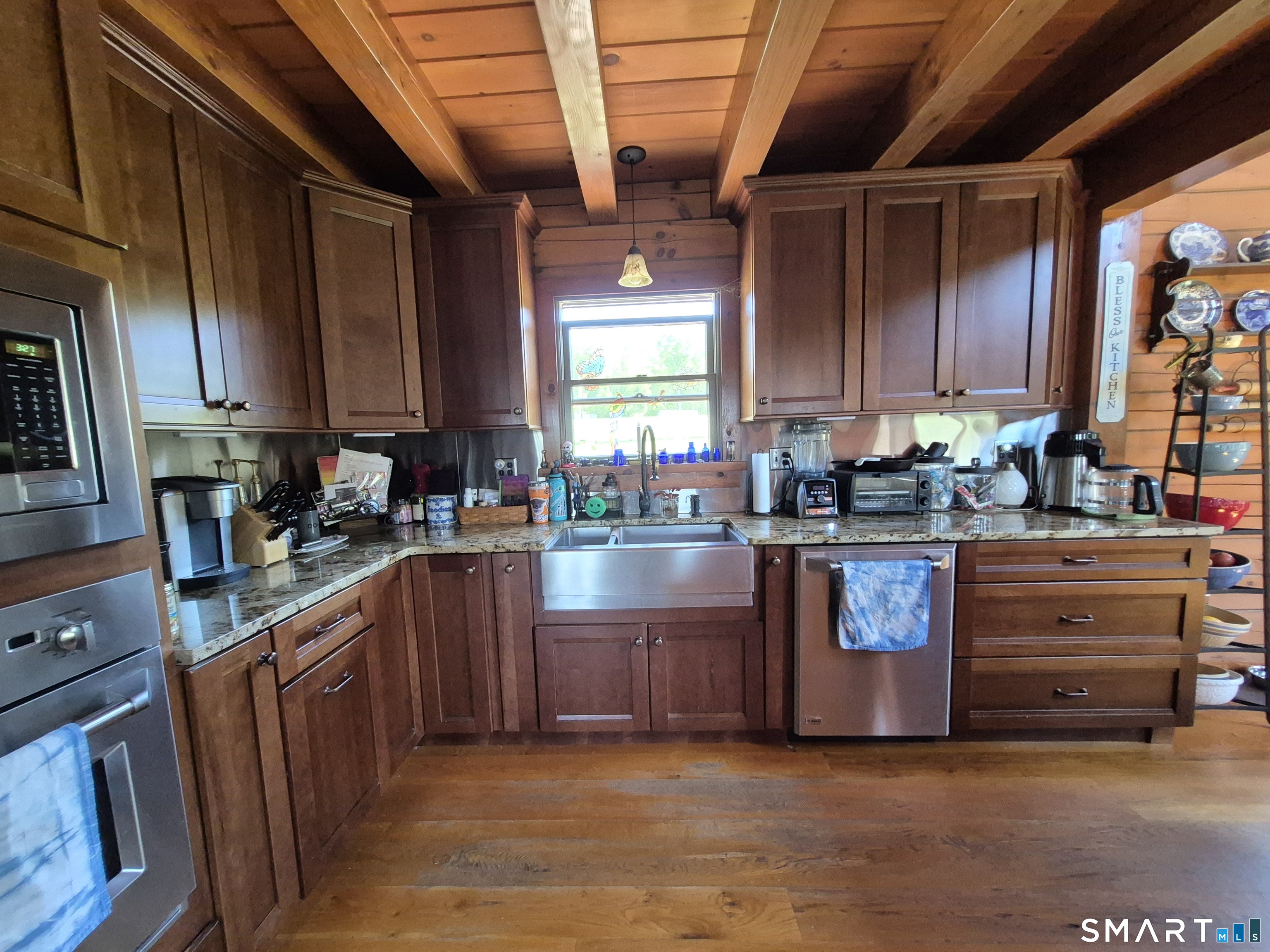 46 Cemetery Road Canterbury, CT 06331 - Photo 22 of 40 a kitchen with stainless steel appliances granite countertop a stove a sink and a refrigerator